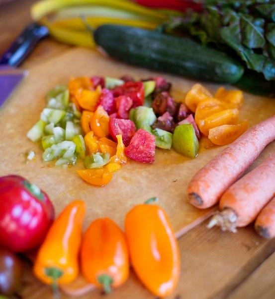 Fresh colorful vegetables chopped on a cutting board — whole food nutrition